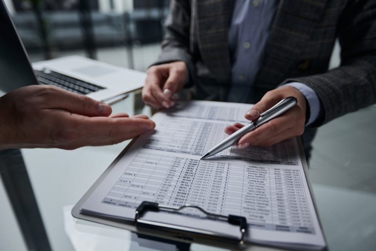 Health and safety audit being carried out with checklist in a workplace environment